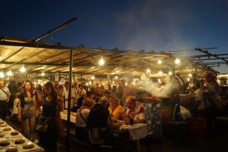 The Central Square at night, full of food stalls.