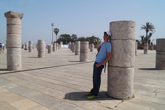 Relaxing in a shadow cast by one of the hundreds of pillars of a ruined mosque outside the Mausoleum of King Mohammed V