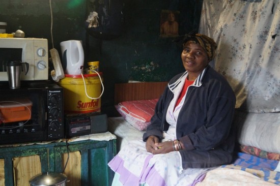 This lovely woman was kind enough to let us into her home. This photo shows her family's living area (1 of 3 in this tiny room).